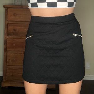 Black quilted mini skirt